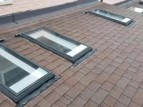 Roof with multiple skylights installed in Toronto