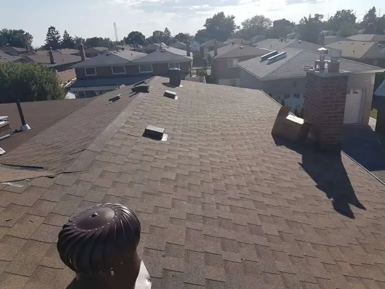 Shingle roof with ventilation system visible