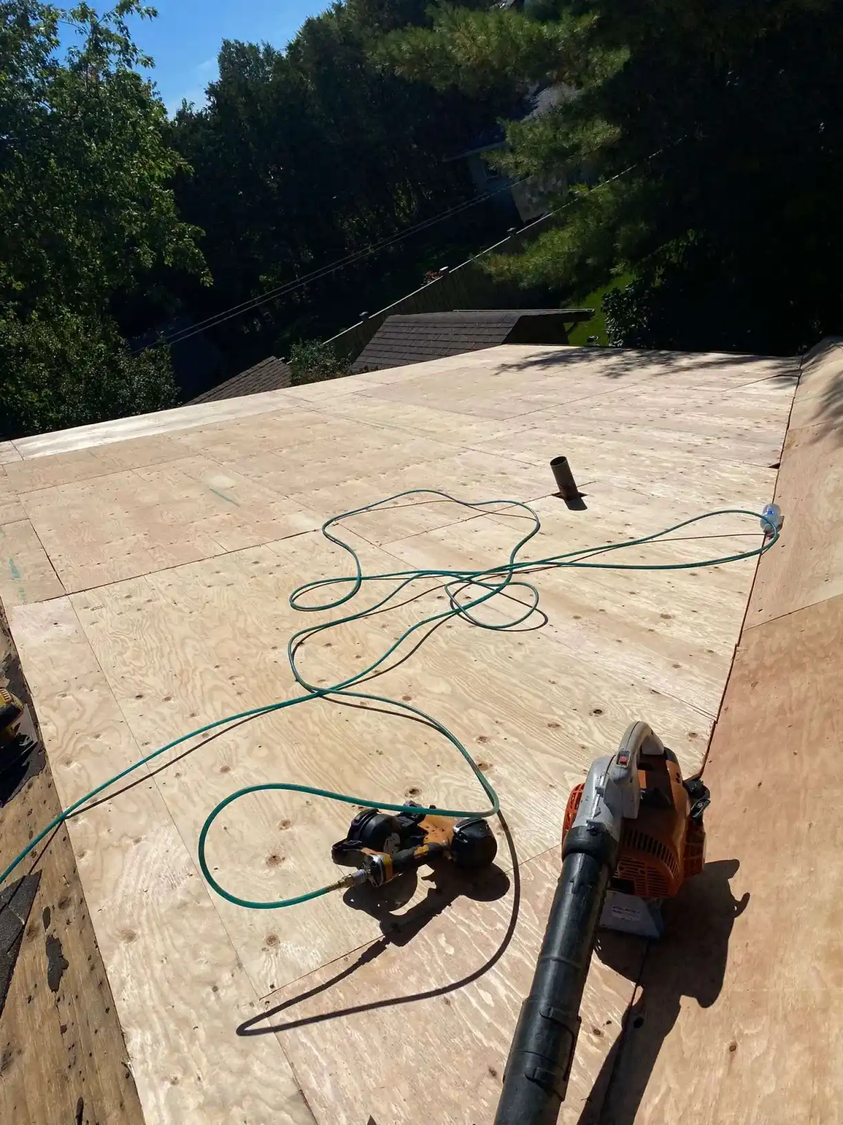 Roofer inspecting a Toronto roof